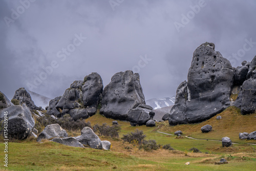 huge strange natural stone from earth quake is beautiful landscape and trekking and we can see snow cap mountain and sheep dog farm Castle hill South Island New Zealand 