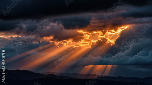 Breathtaking sunset illuminates dark clouds with rays of light breaking through, symbolizing gratitude in hard times and beauty of nature