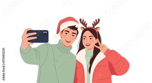Festive couple taking a selfie, wearing Christmas hats and reindeer antlers.