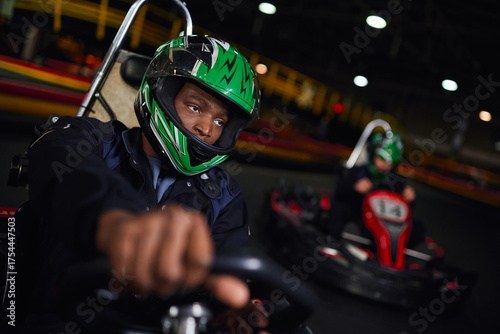 Wallpaper Mural Racing thrill and excitement during indoor carting adventure with friends Torontodigital.ca