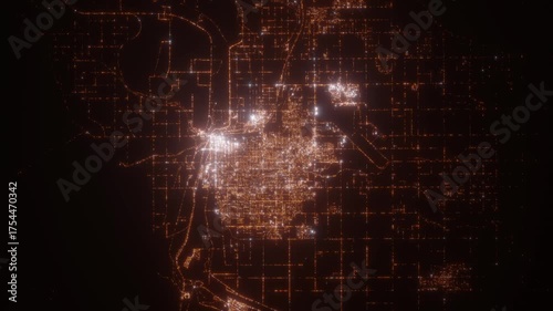 Yuma (Arizona, USA) top view at night. Aerial view on modern city from space. Camera is flying above the city, moving forward. Vertical video. The north is on the left side