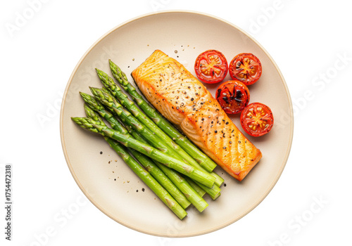 Isolated dinner plate with grilled salmon, asparagus, and roasted tomato halves on a plate