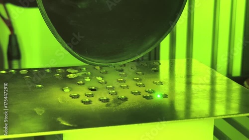 Interesting process of applying a coating through a special technique under green light in a lab environment