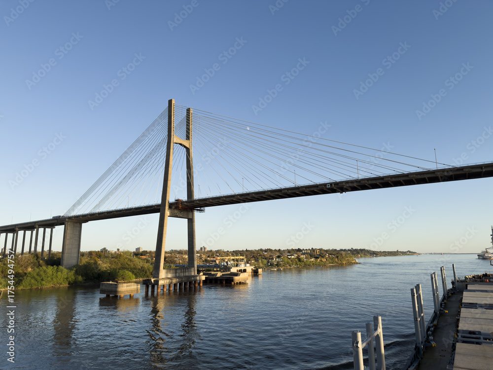 Fototapeta premium cargo ship passing under the bridge 25.