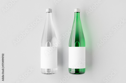 Water bottle mockup, green and clear glass, blank label