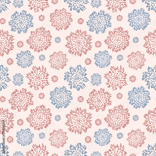 A seamless pattern featuring a whimsical arrangement of stylized snowflakes in blue and red hues scattered across a pale pink background.