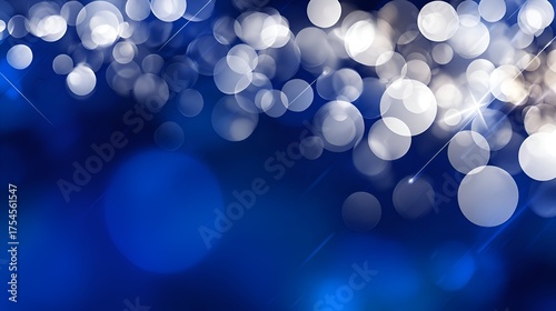 Abstract blue background with soft glowing bokeh lights creating a dreamy atmosphere for design use