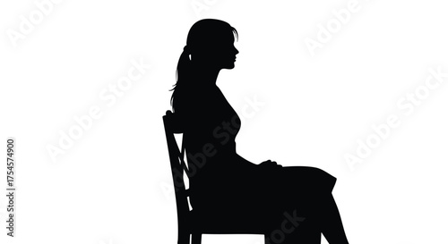 Silhouette of a woman sitting on a chair, seen from the side against a white background