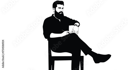 Man with a beard sitting on a chair with a pen and notepad, business and creativity concept