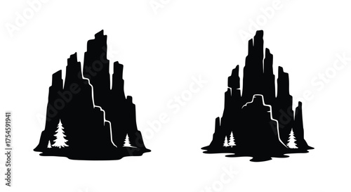 Dramatic black silhouette of rocky mountains with a solitary tree below