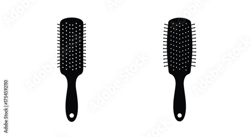 Two black hairbrushes with vented designs isolated on a white background