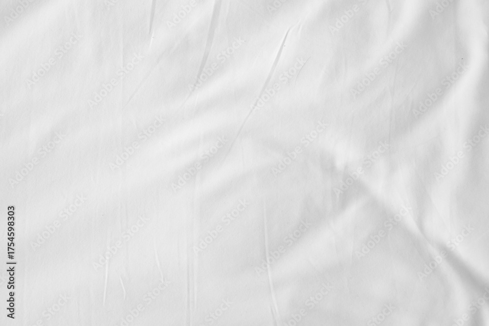 Obraz premium Abstract White Bedding Sheets or White wrinkled fabric background texture and Texture with copy-space :Creased or wrinkled white fabric,Soft focus