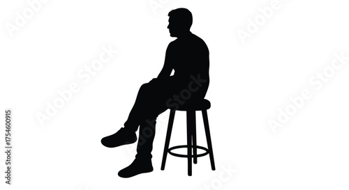 Silhouette of a man sitting on a stool