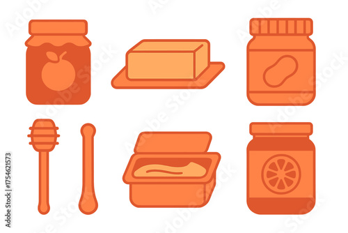 Set of breakfast spreads and condiments including jam, butter, peanut butter, and honey dippers