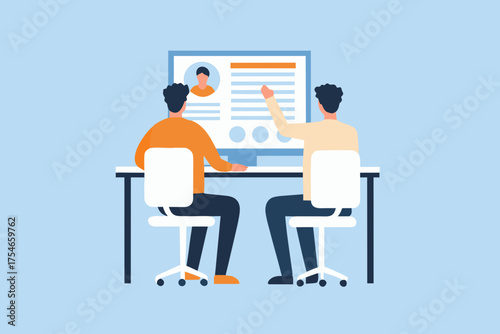 Two people sitting at a desk reviewing a computer screen displaying a profile or resume