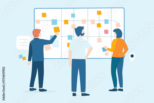Diverse team collaborating on a project using a kanban board with sticky notes for planning and organization