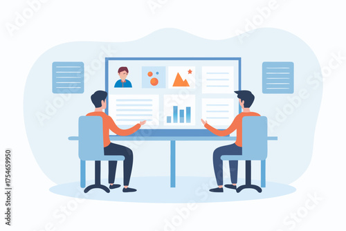 Two people collaborating in a modern office discussing data and charts on a large screen