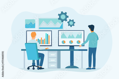 Two professionals analyzing data charts and graphs on multiple computer screens in an office setting