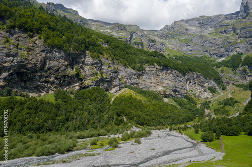 This landscape photo was taken in Europe, France, Auvergne-Rhone-Alpes, Haute-Savoie, Sixt-Fer-a-Cheval, in summer. It shows the hiking trail in the mountains of the Cirque du Fer-a-Cheval