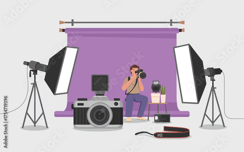 Photography studio setup with camera lights backdrop and photographer capturing a moment