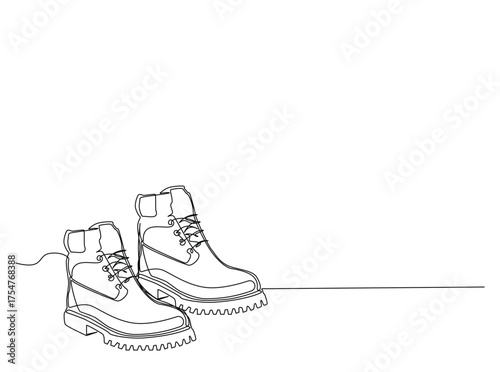 Hiking boots  in single outline illustration. Continuous line art drawing of working boot. Editable stroke.