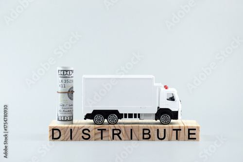 White toy truck on blocks with the text DISTRIBUTE.