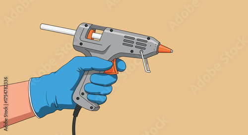 A gloved hand holds a grey and orange glue gun ready to dispense hot melt adhesive.