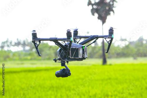 Professional cinema camera drone filming natural green agri feild
