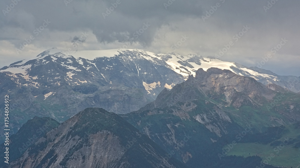 Obraz premium granite mountain peaks with glaciers under a dark stormy sky n La Vanoise national park, Savoie, France 