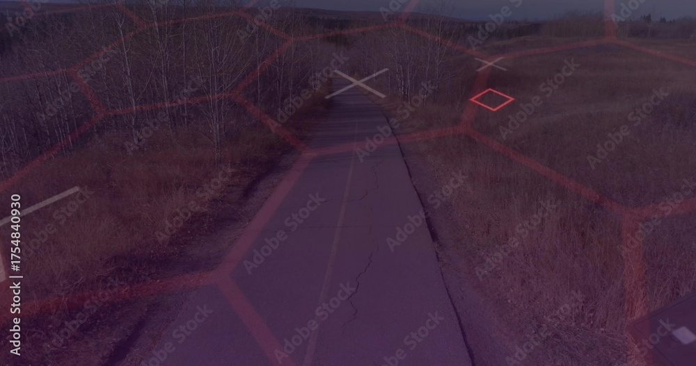 Obraz premium Stretching cracked asphalt road toward horizon in open grassland, with faded yellow center line