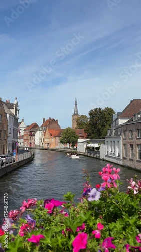 Colorful flowers and people riding a river on a sightseeing boat. Beautiful vertical travel footage.