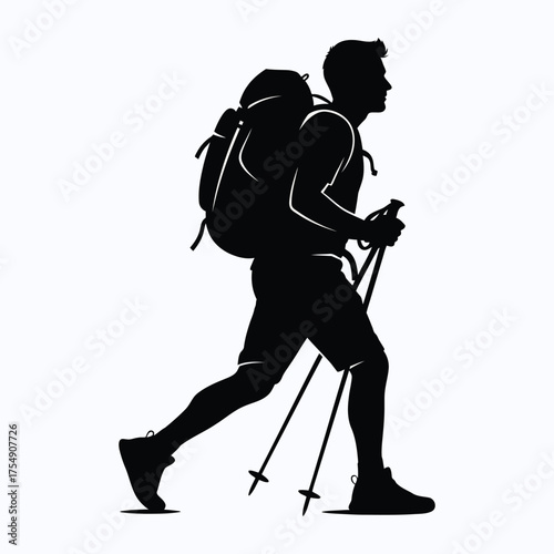 Hiker with backpack and trekking poles in striking black silhouette