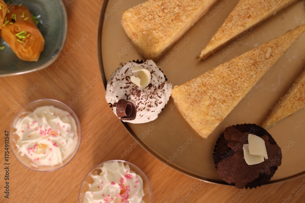 Fototapeta premium Buffet menu. Delicious desserts on table, flat lay