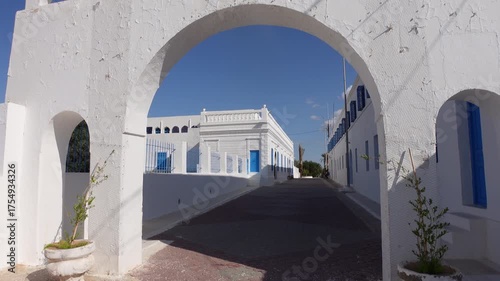 Walking towards the entrance of the El Ghriba synagogue, Jewish religion and historic landmark in Tunisia