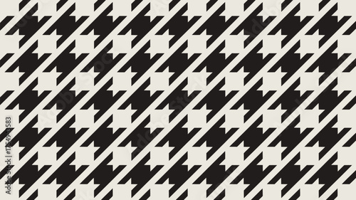 A repeating black and white houndstooth pattern diagonally oriented across the entire image plane