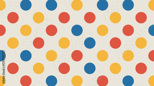 A seamless pattern of red yellow and blue polka dots on a light beige background arranged regularly