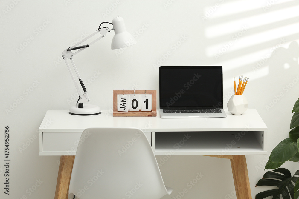 Fototapeta premium Desktop calendar on a modern desktop. Schedule and time planning in office and business.