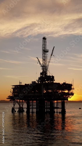 Wallpaper Mural Aerial shot of an offshore oil platform at sunset. Vertical Video. Torontodigital.ca