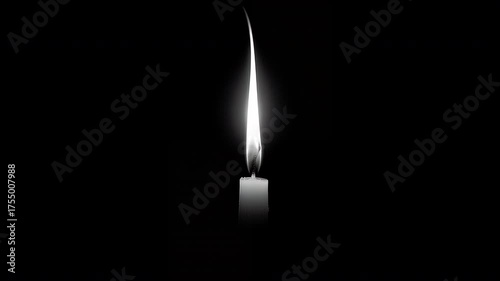 Single white candle burning in darkness with tall flame, creating calm solemn atmosphere. Concept of memory and hope

