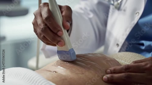 A doctor performs an ultrasound on a patient's abdomen, using a transducer with gel.