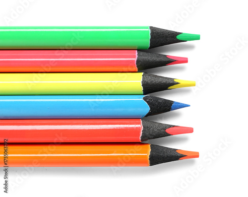 Many colorful pencils on wh...