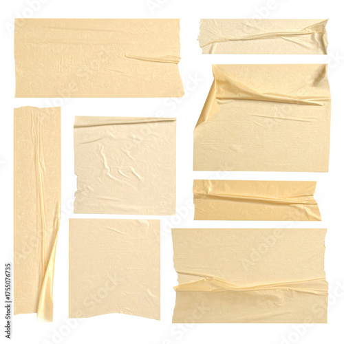 A mosaic of torn, weathered beige adhesive strips arranged against a stark black backdrop