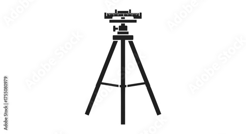 Surveying instrument on a tripod for precise measurements.