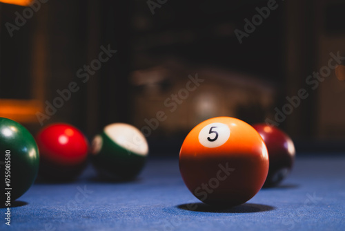 Colorful billiard balls on an american pool table. Vibrant pool balls on felt table surface. 