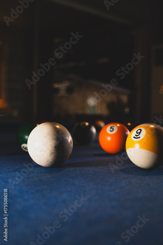 Colorful billiard balls on an american pool table. Vibrant pool balls on felt table surface. 
