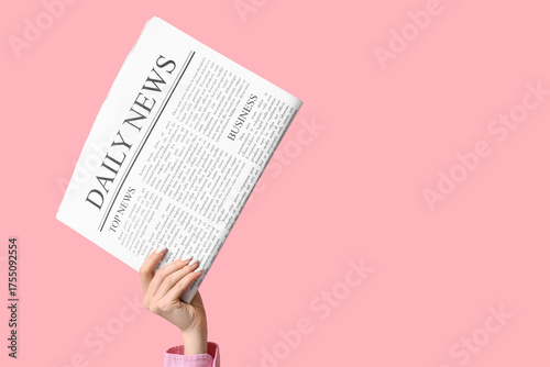 Female hand with newspaper ...