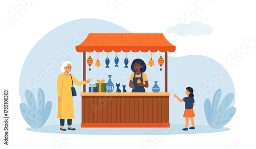 Souvenir shop with awning. Street market kiosk. Local outdoor fair. Antique store. Street stand with presents, gifts, decorative vases and buyers at counters. Vendor serving souvenirs to customers
