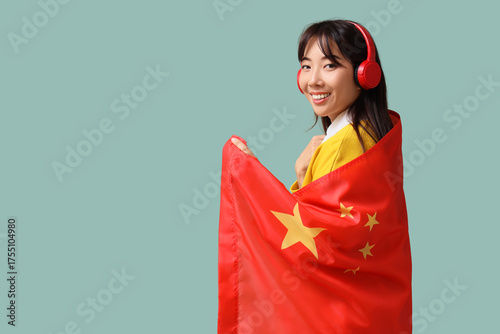 Young Asian woman in headph...