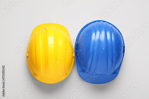 Blue and yellow hardhats on...