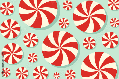 Swirling red and white peppermint candies create a festive pattern on a light blue background